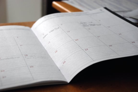 A monthly planner on a desk
